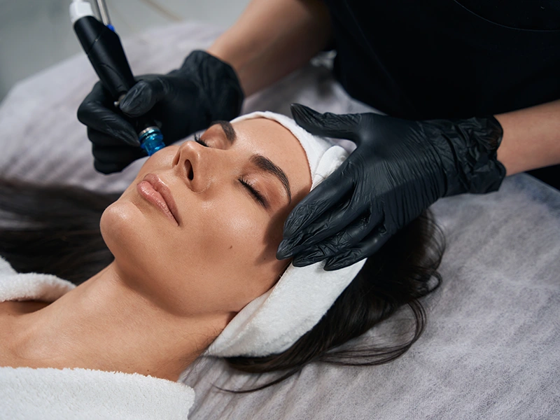 Client relaxing during a facial treatment at Beautiful Body and Beyond in Corona, CA