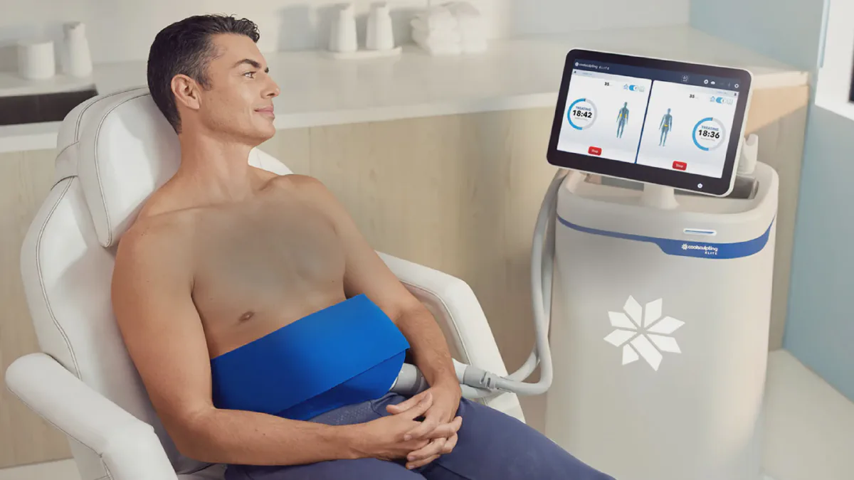 Patient relaxing during a CoolSculpting Elite treatment beside the Elite system at Beautiful Body and Beyond in Corona, CA