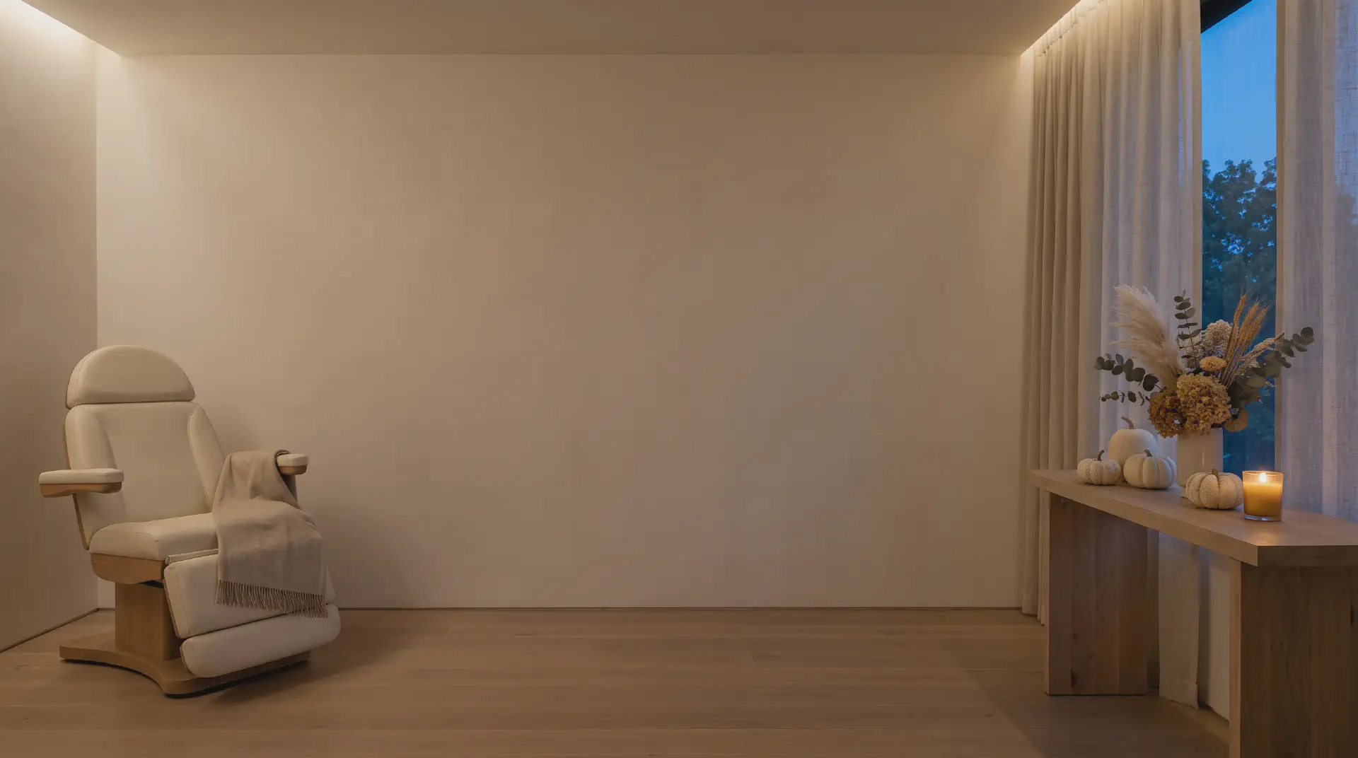 Candlelit treatment room with cream-white pumpkins at Beautiful Body and Beyond in Corona, CA, announcing the October 2026 specials